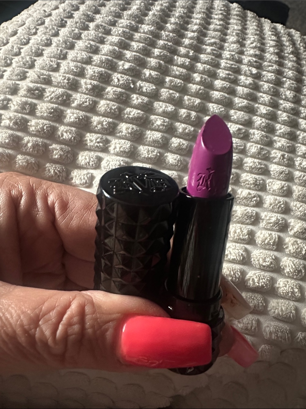 Kat Von D Bright Violet Matte Lipstick in the shade of  LUV